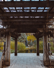 Vertical Shot Of A Wooden Structure In A Park