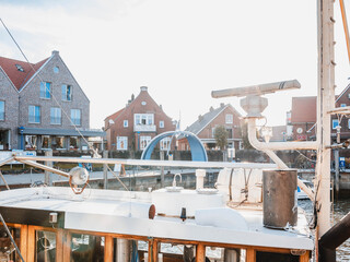 Wall Mural - Scenic view of a city port with ships and residential buildings