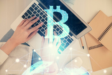 Poster - Double exposure of woman hands working on computer and blockchain theme hologram drawing. Top View. bitcoin cryptocurrency concept.