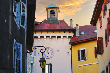 Wall Mural - A colorful building and clock tower in the old town of Annecy in France