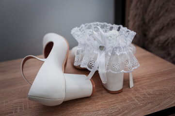 Wall Mural - White shoes and bridal garter. Bride morning. Bride's accessories