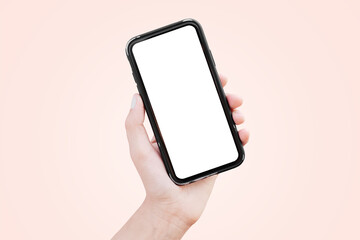 Wall Mural - Smartphone in hand with blank on screen. Pastel background. Mockup concept.