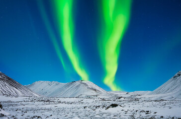 Wall Mural - nature. aurora borealis in iceland. northern lights over the mountains. a winter night landscape wit