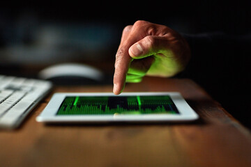 You can click but you cant hide. Cropped shot of an unidentifiable hacker cracking a computer code in the dark.