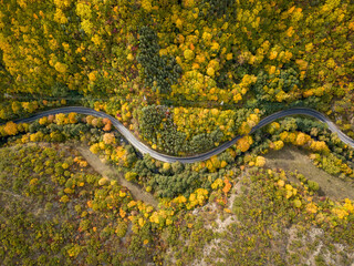 Wall Mural - aerial view of road along rila mountain range in bulgaria during autumn