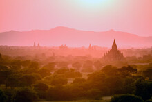 Dawn And Mist In The Air Above Temple On The Plain In Mandalay.