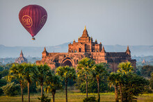 Hot Air Balloon In The Air Above A Temple In Mandalay.