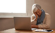 © Marius Venter/peopleimages.com - Retirement fund worries.... An elederly woman sitting in front of her laptop looking stressed and worried.