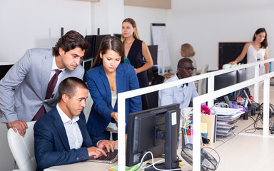 Wall Mural - Friendly women and men in office. Working process in open space modern office