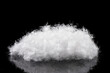small soft down white fluffy feathers isolated on black background
