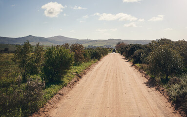 Wall Mural - The muddiest road may end up somewhere amazing. Shot of an empty farm.