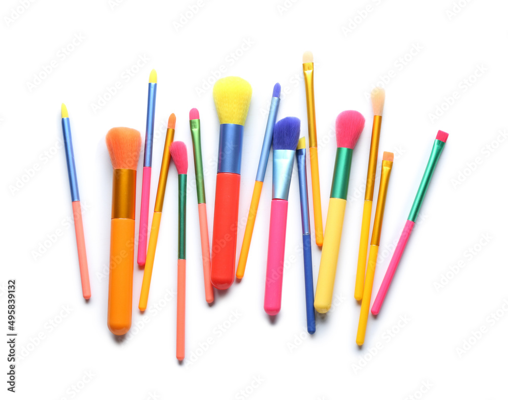 Set of colorful makeup brushes isolated on white