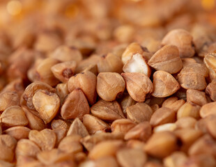 Wall Mural - Close-up of buckwheat groats as background.