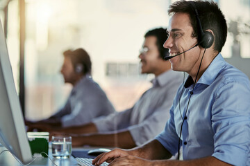 Aufkleber - Committed to quality customer support. Cropped shot of a call centre agent working in an office with his colleagues in the background.