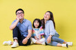 © Timeimage - Portrait of young Asian family on background