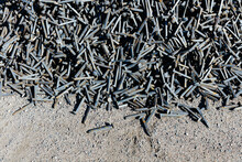 Railroad Depot, A Heap Of Discarded Metal Pins, Track Spikes Used On The Railroad Track. 