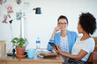© Yuri Arcurs/peopleimages.com - Shot of an attractive young woman sitting at her workstation in the office. The commercial designs displayed in this image represent a simulation of a real product and have been changed or altered