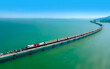 © Tanongsak - Aerial view of Travel train parked on a floating railway bridge over the clear water of lake in Pa Sak Jolasid dam with blue sky at Lopburi, amazing Thailand.