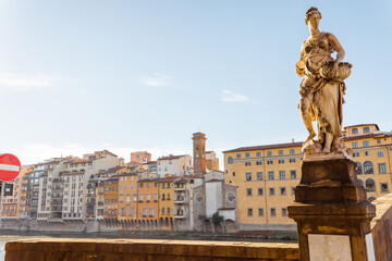 Wall Mural - Riverside with old buildings and sculpture of Holy Trinity bridge in Florence. Travel italian cities of Tuscany. Italian Renaissance architecture