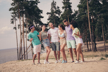 Poster - Photo of six cheerful positive friends people gathering cuddle walk wear casual outfit nature seaside beach