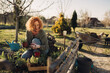 © cherryandbees - woman growing organic vegetables in her backyard