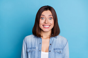 Photo of adorable sweet lady dressed denim shirt showing white teeth smiling isolated blue color background