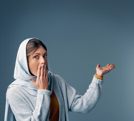 Poster - This one took me by surprise. Cropped portrait of an attractive young woman endorsing your product while standing against a grey background.