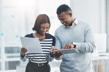 Aufkleber - Share your best ideas with the touch of a button. Shot of two young businesspeople standing in their office and working together using a digital tablet.