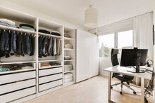 Interior Of Workroom With Wardrobe And Office Table