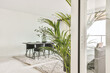 © ADDICTIVE STOCK - Living room with plants and table with chairs