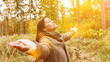 © Robert Kneschke - Woman breathing air in the forest with breathing exercise