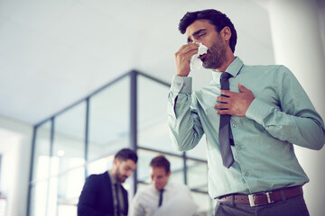 Fototapete - Feeling groggy with flu. Cropped shot of a businessman suffering with allergies in an office.