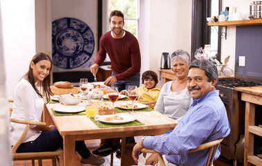 Canvas Print - Our family is a circus without a tent. A happy man serving lunch to his family.