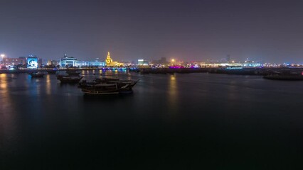 Poster - Evening at Doha Bay day to night timelapse with Traditional Wooden Dhow Fishing Boats.