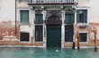 door of the palace in Venice with the entrance completely submerged due to the high tide