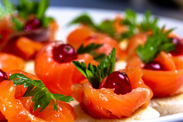 Wall Mural - Canapes with lightly salted salmon and lingonberries