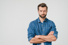 Offended Sad Angry Caucasian Young Man With Arms Crossed Blowing His Lips Looking At Camera Isolated In White Background. Conflict Anger Concept