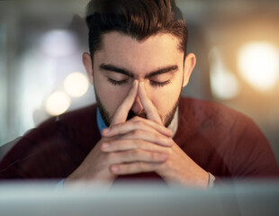 Aufkleber - Searching for motivation. Shot of a tired young designer working late in the office.