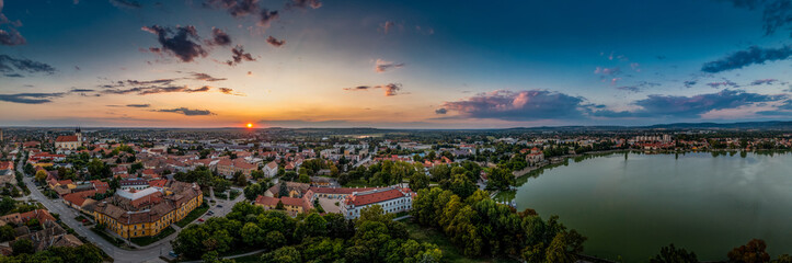 Wall Mural - Aerial sunset view over the old lake of Tata with medieval castle surrounded by moat, bastions and walls in Hungary