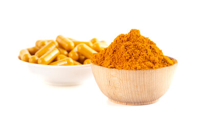 Wall Mural - Ground Turmeric in Capsule form on a White Background