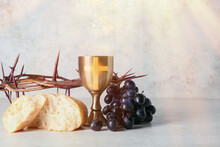 Chalice Of Wine With Grapes, Bread And Crown Of Thorns On Light Background. Holy Communion Concept