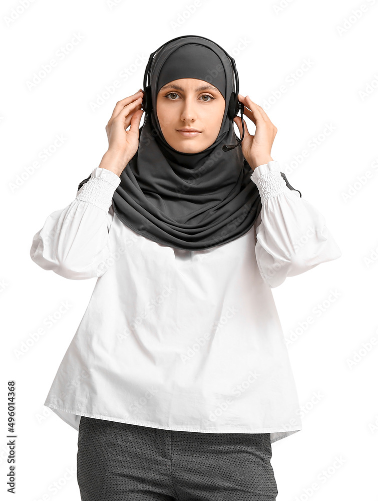 Muslim secretary with headset on light background