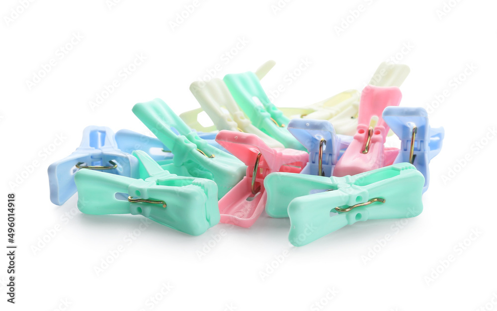 Plastic clothes pins on white background