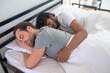 © zinkevych - Romantic gay couple dozing in their bedroom