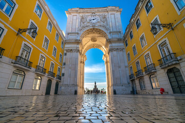 Sticker - Rua Augusta Arch at sunrise in Lisbon, Portugal. Statue of King Jose I on Commerce Square at the far end