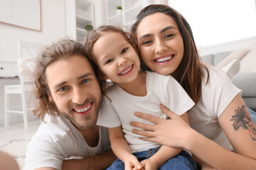 Sticker - Happy young family taking selfie at home