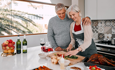 Aufkleber - She boasts the best roast. Shot of a mature couple preparing a Thanksgiving meal at home.