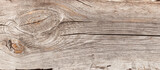 Fototapeta  - Naturalne tło niejednolitych starych grubych drewnianych desek z teksturą korozji drewna.. Kolory brązu. Tapeta.