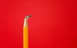 © xy - Broken pencil tip on red background