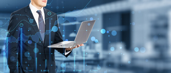Poster - Close up of businessman hand using laptop in blurry bokeh office interior with creative glowing business chart and wide mock up place for your advertisement. Growth, sales and market concept. 